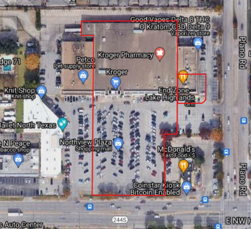 Satellite image of a building that contains multiple businesses. There is a red outline over only part of the building indicating the polygon extent for that specifc business.